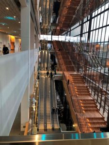 An overhead view of the escalators, stairs, and stepped seating area of the Summit expansion to the Seattle Convention Center.