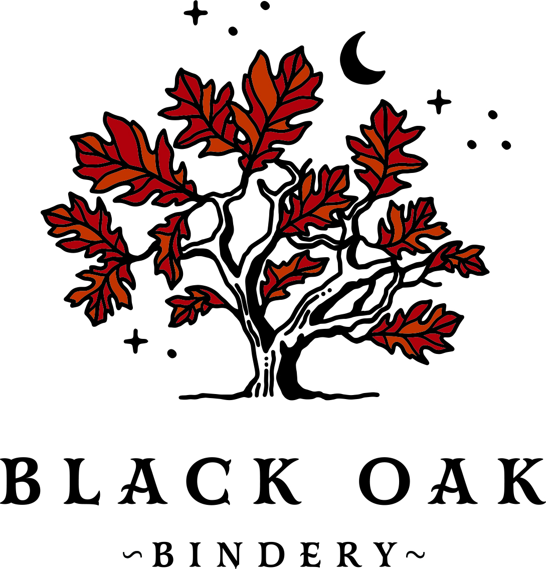 The logo for Black Oak Bindery which is an oak tree with red leaves surrounded by a moon and stars.