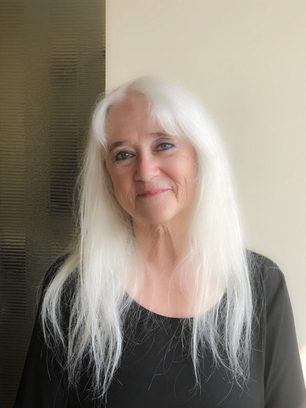 This is a photo of Deborah Fay Morales. Most striking feature is long silver hair!