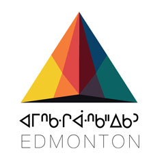 Pyrimidal structural made of multiple colours atop Cree syllabics for Beaver Hills House (the Cree name for Edmonton), Edmonton.