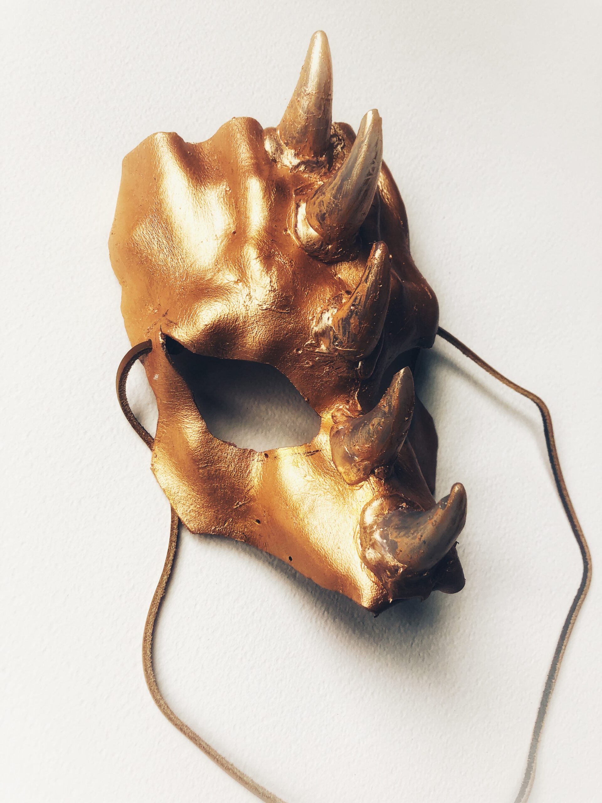 Gold leather dragon mask