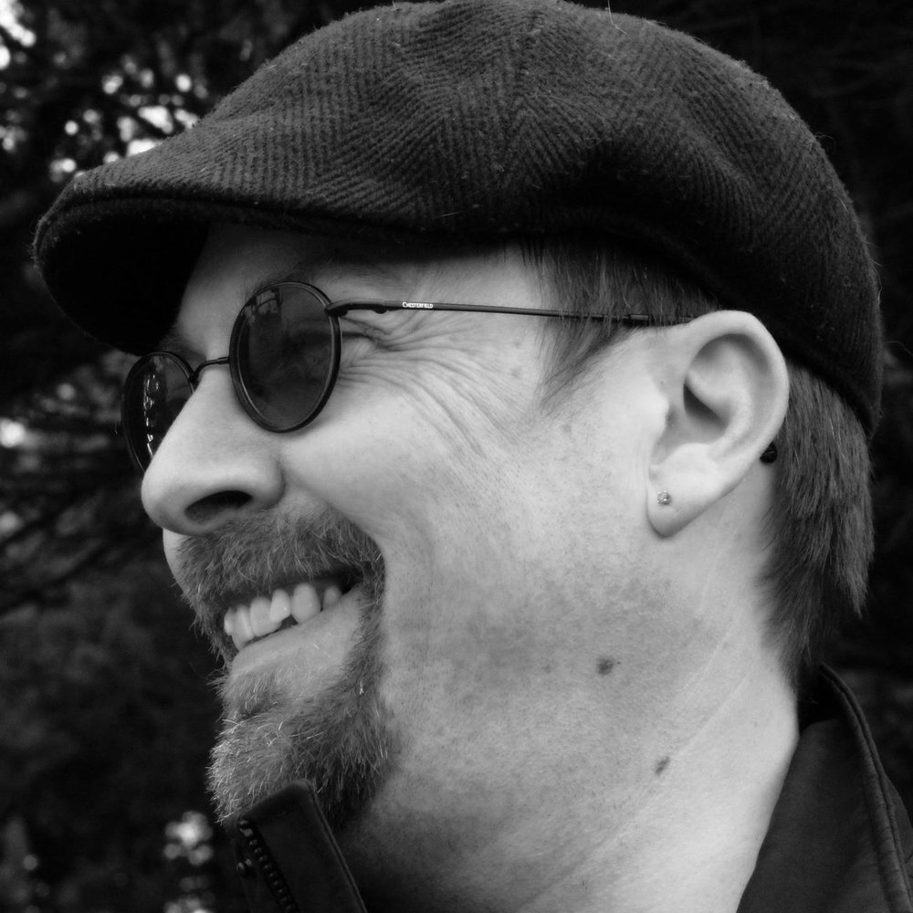 A side portrait of Michael Brugger's face.