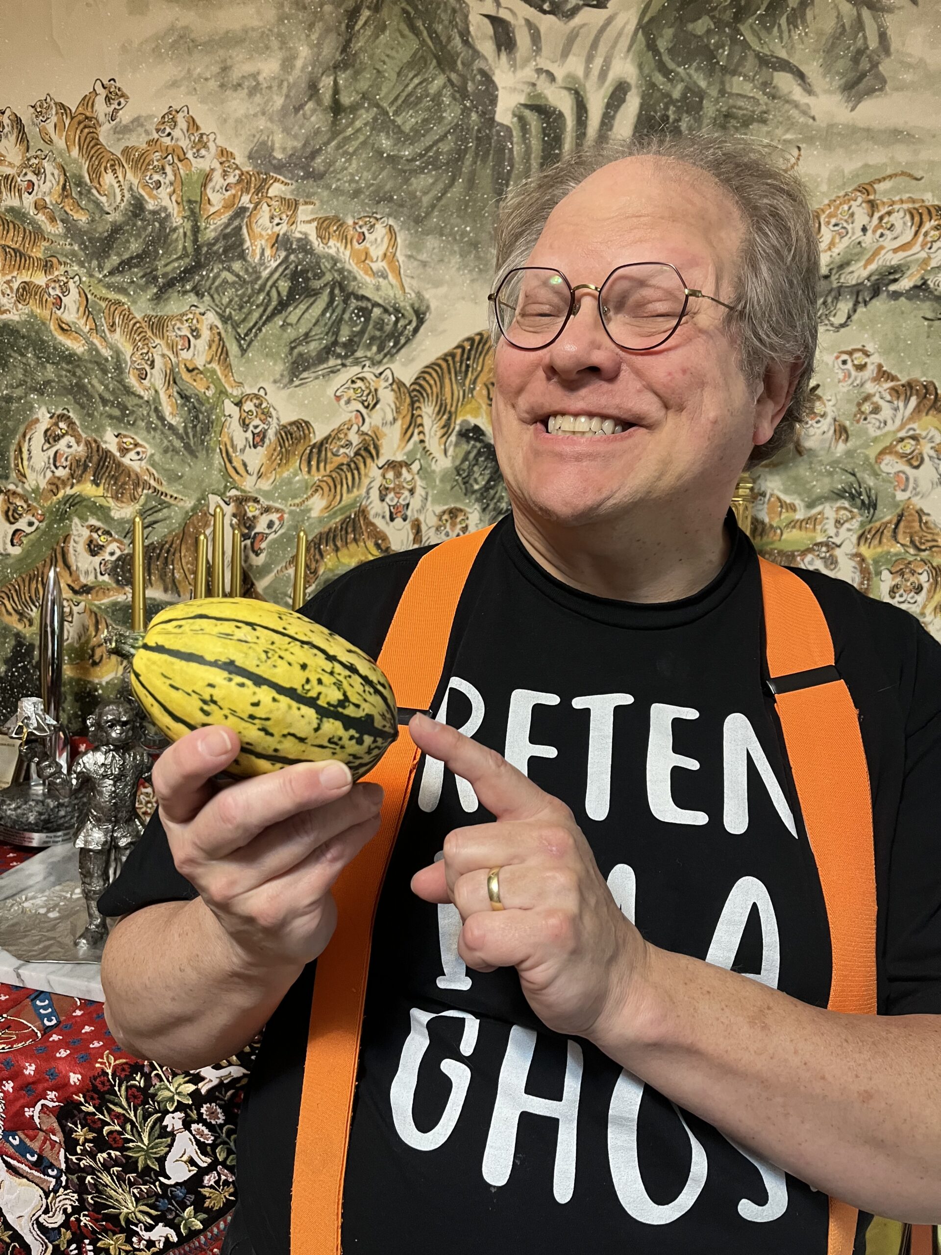 A portrait of Phil Foglio, pointing to the break-out star of his next comic.