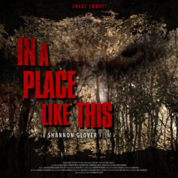 Poster for In A Place Like This, featuring a shadowed wood.
