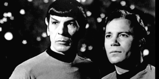 Black and white publicity photo of Spock and Kirk from the original Star Trek series.